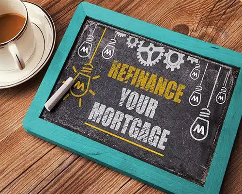 Chalk board with Refinance your mortgage written on it