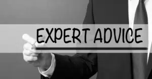 The words 'EXPERT ADVICE' in bold, with a professionally dressed person in a suit giving a thumbs-up, symbolizing trusted guidance in the home-buying process.