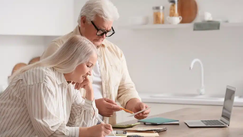 Couple reviewing mortgage finances as falling behind no longer feels temporary in New Zealand