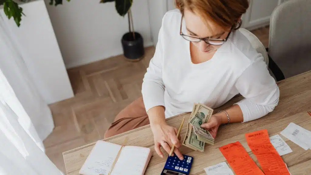 Borrower reviewing bills and household cashflow as mortgage repayments become harder to catch up in New Zealand