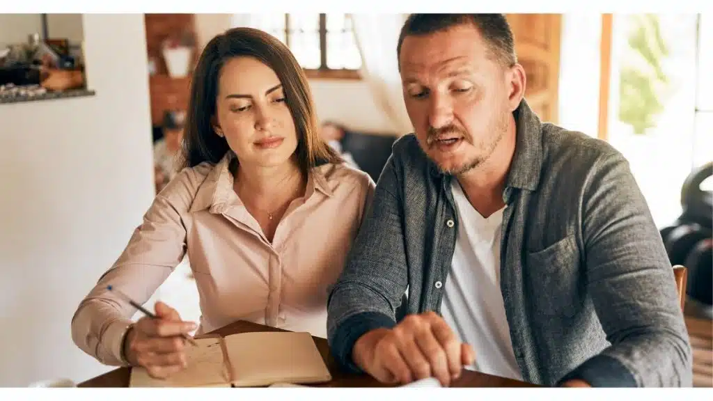 Couple reviewing household finances as rising mortgage costs begin affecting the monthly budget