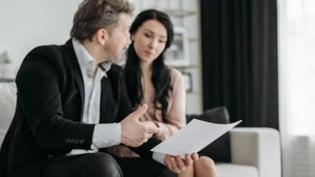 Borrowers reviewing mortgage paperwork to better understand lender communication in New Zealand
