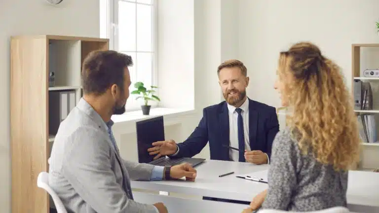 Mortgage broker discussing home loan options with borrowers